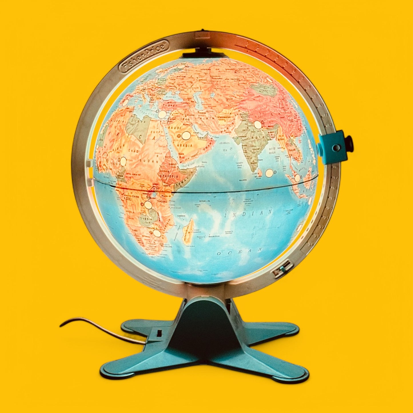 Fisher Price Illuminated Globe features vibrant colors and 24 interactive locations, perfect for educational play.