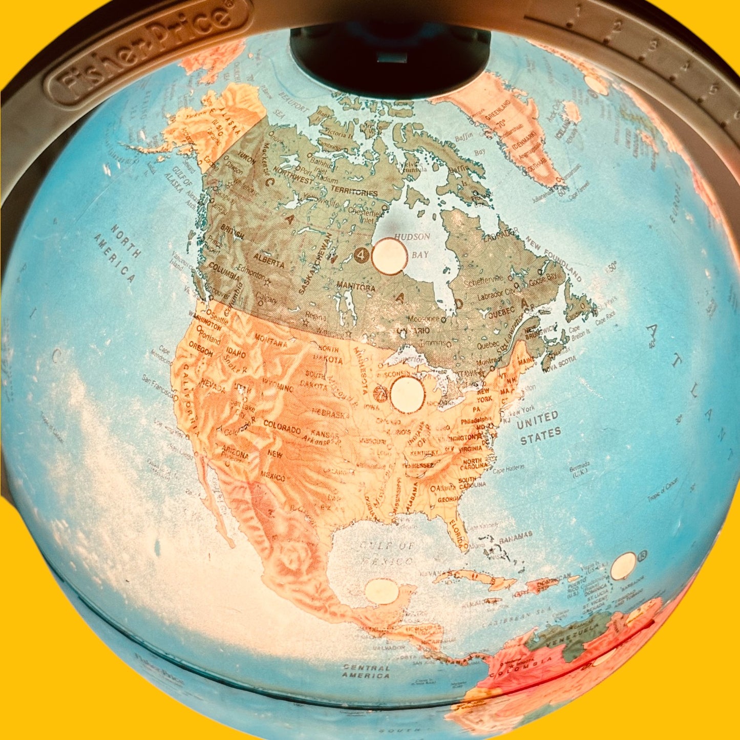Fisher Price Illuminated Globe showcasing vibrant colors and 24 interactive locations, perfect for educational play.
