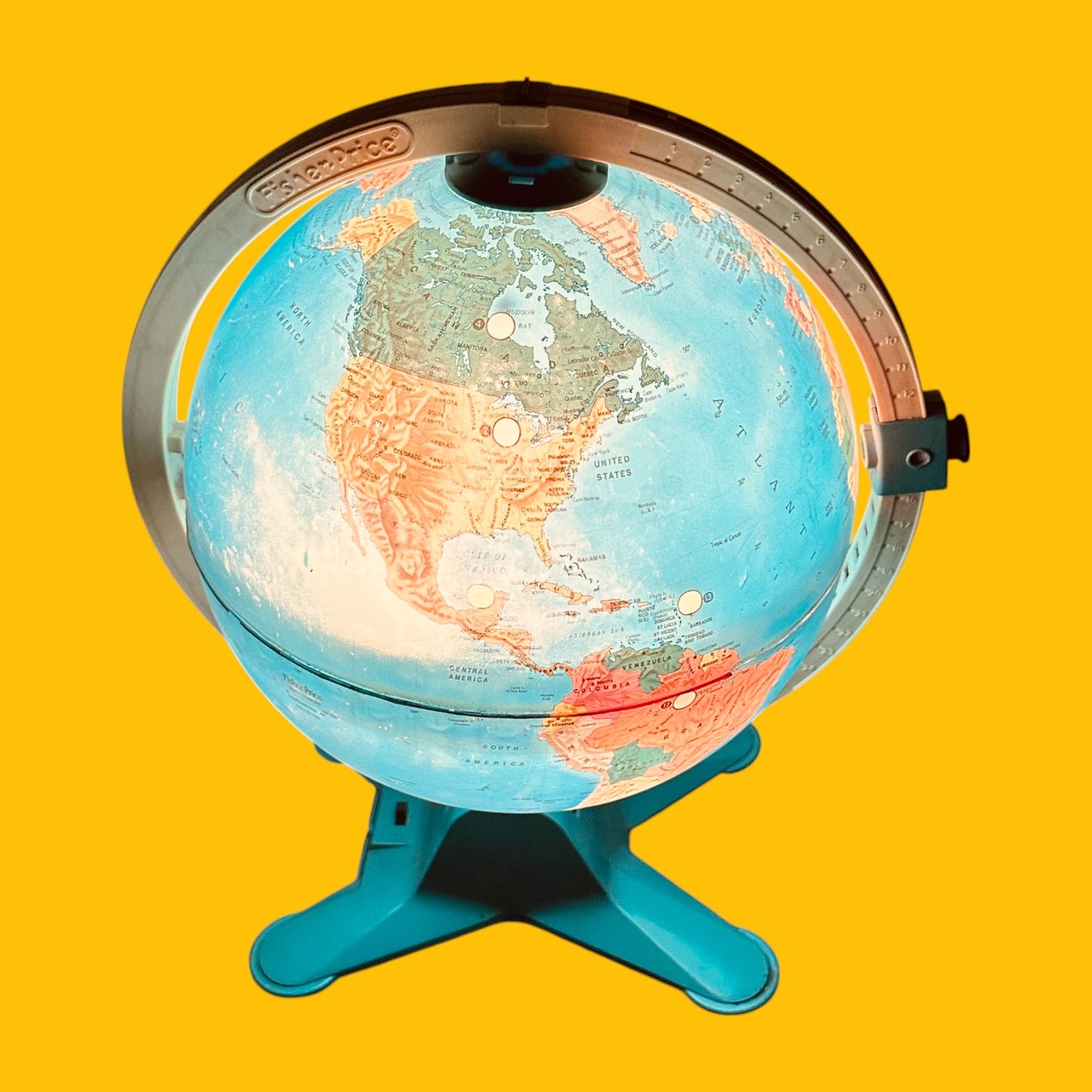 Fisher Price Illuminated Globe showcasing vibrant colors and 24 interactive locations, perfect for learning and play.