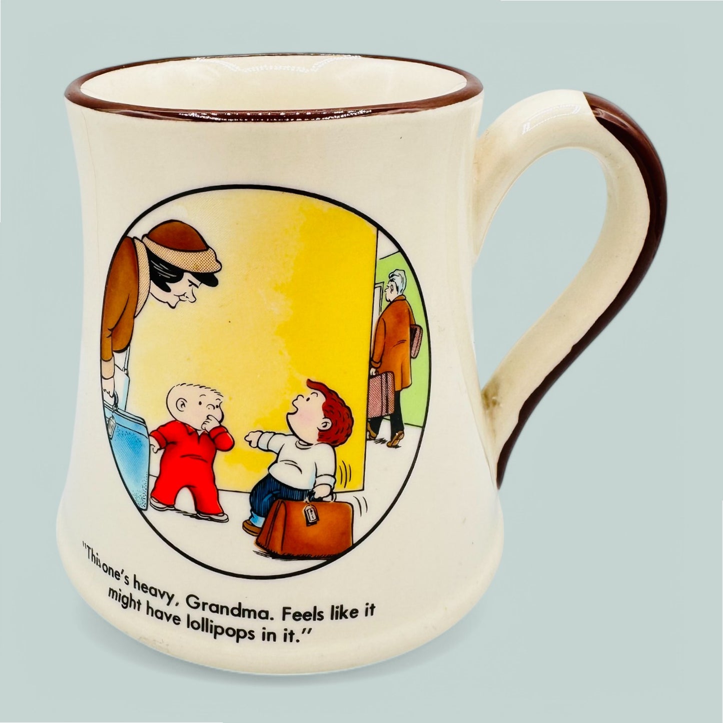 Vintage Family Circus Mug featuring cartoon characters and the quote, “This one’s heavy, Grandma. Feels like it might have lollipops in it.”