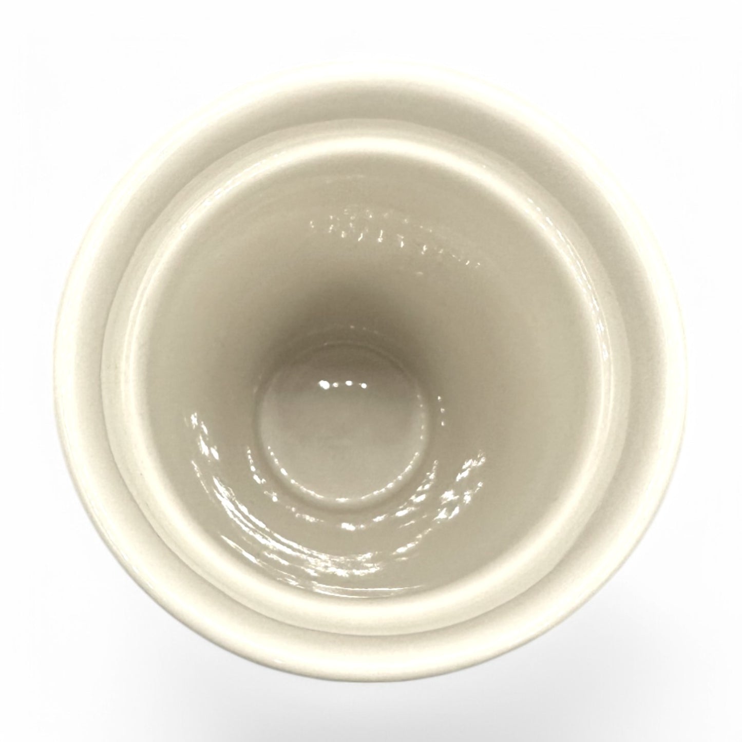 Ceramic interior of a Starbucks Travel Tumbler Mug, featuring a sleek black lid and modern design.