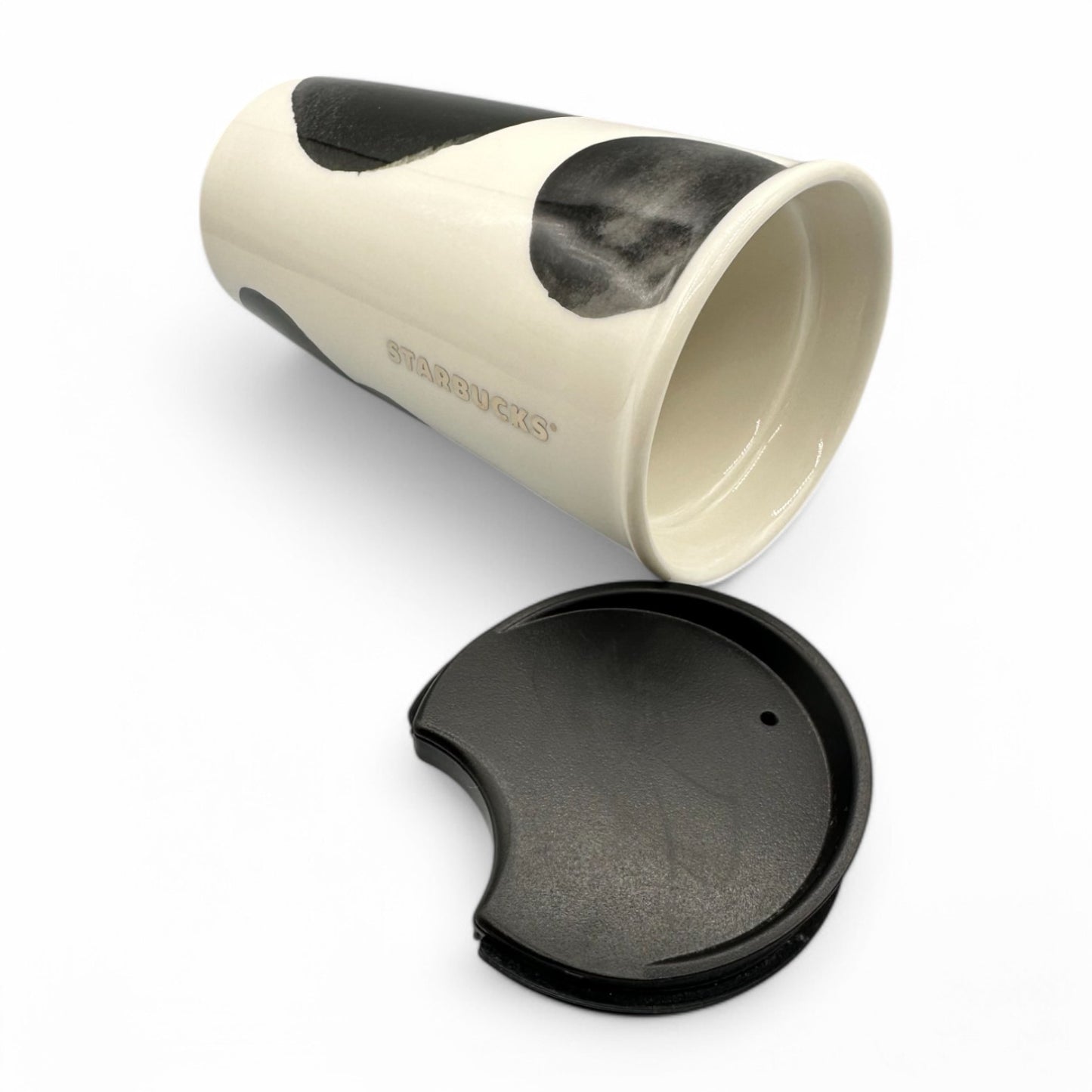 Stylish Starbucks Travel Tumbler Mug in black and white, modern design, insulated ceramic with a black lid.