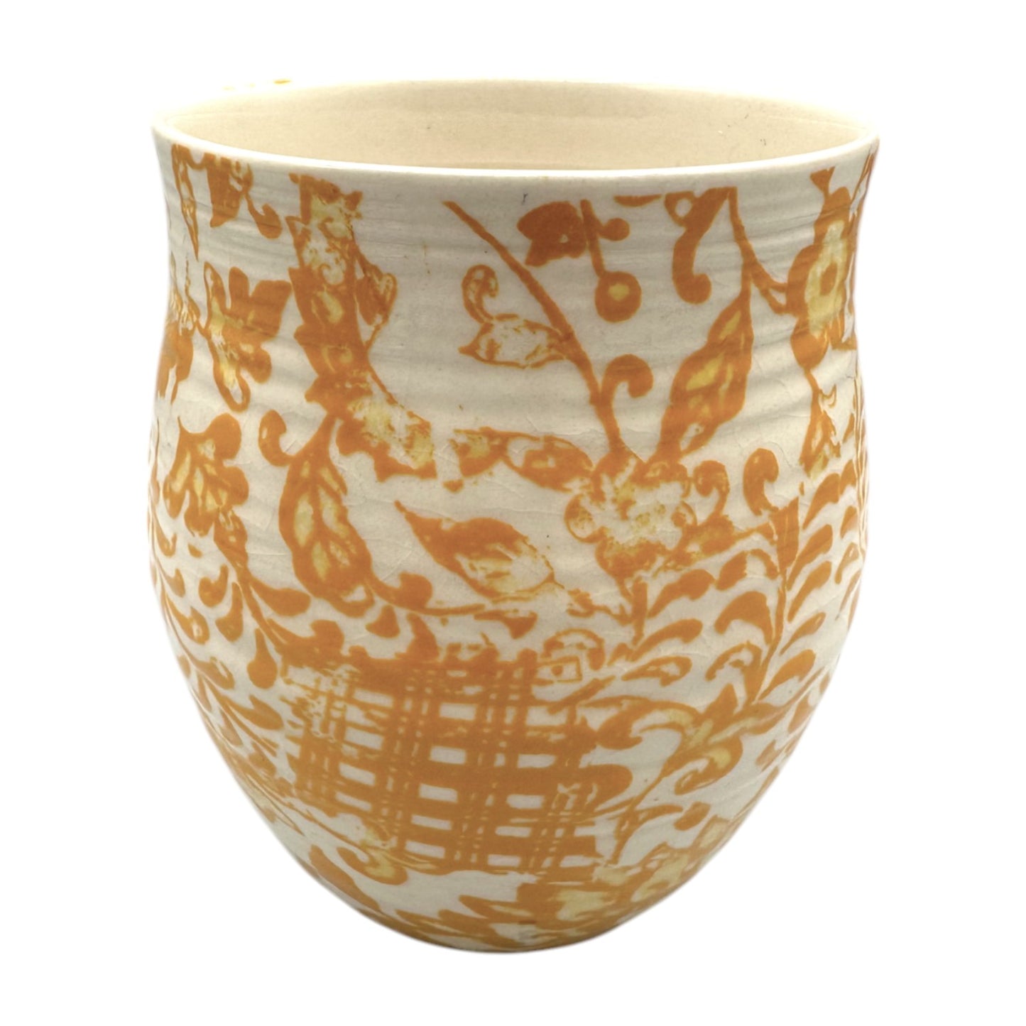 Curved Anthropologie mug featuring monogram H in floral beige, yellow, and brown design with light crazing.