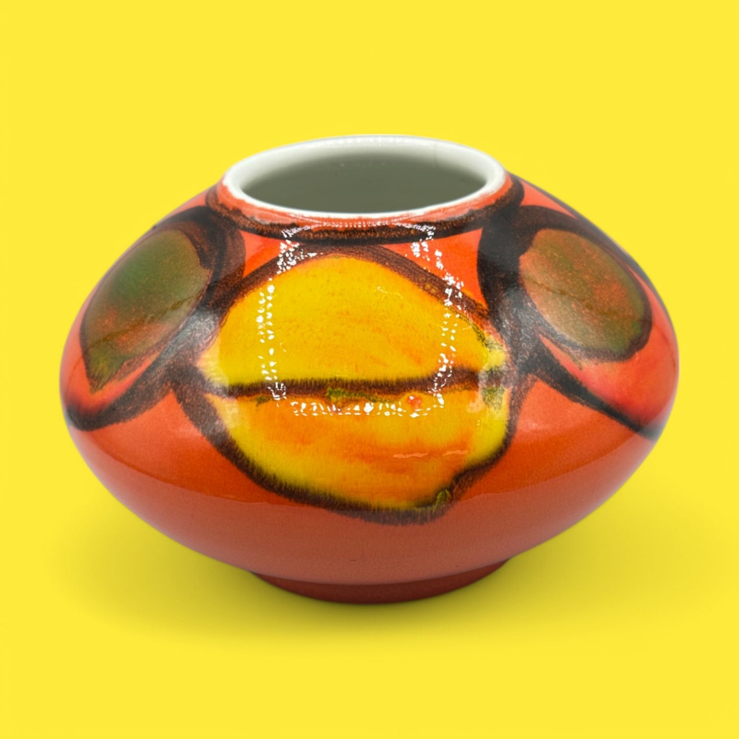 Brightly colored Poole pottery number 32 onion vase, designed by Robert Jefferson, showcasing vibrant Delphis ware style.