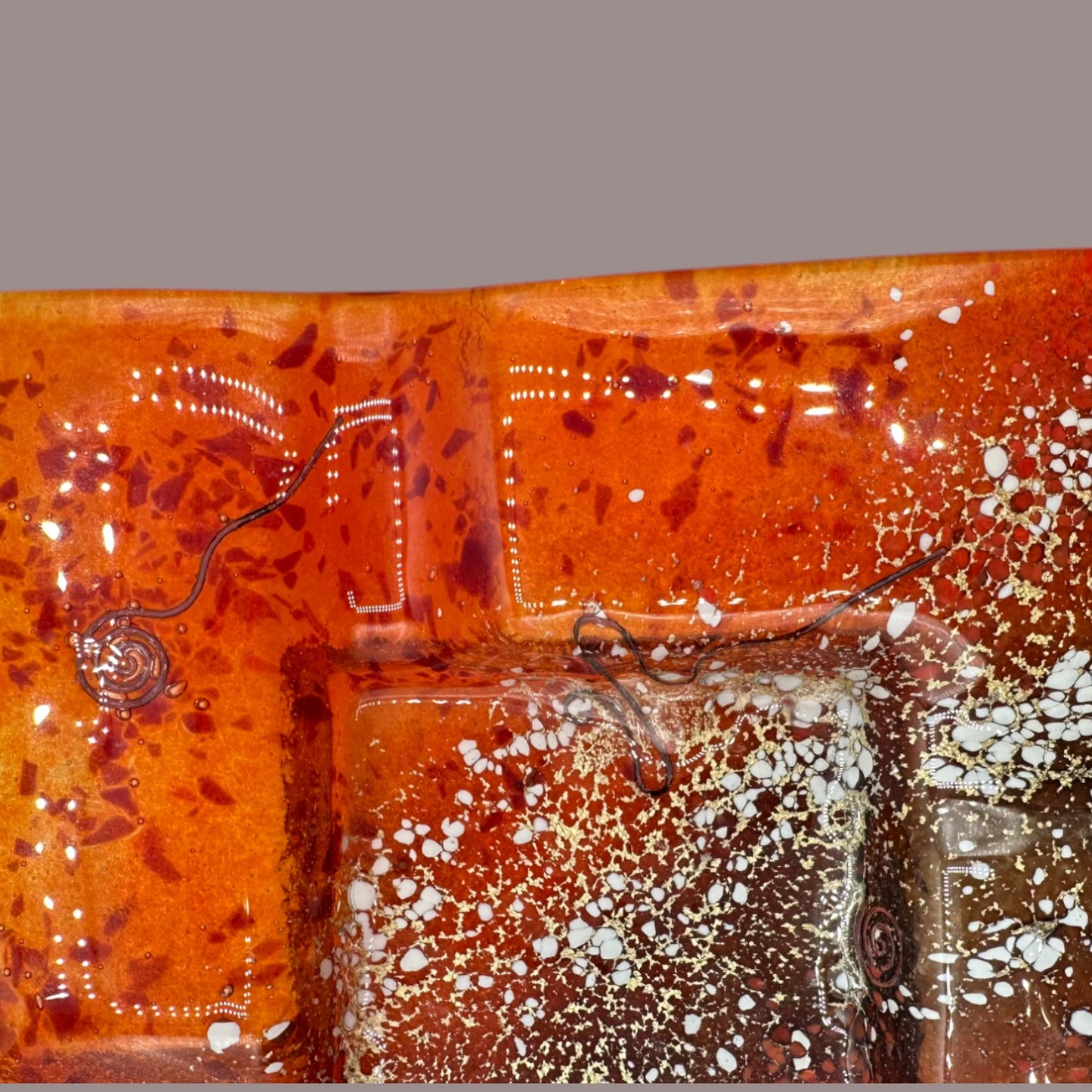 Stunning Vintage MCM Orange Fused Glass Sunburst Ashtray Decor showcases vibrant hues and dynamic textures for your collection.
