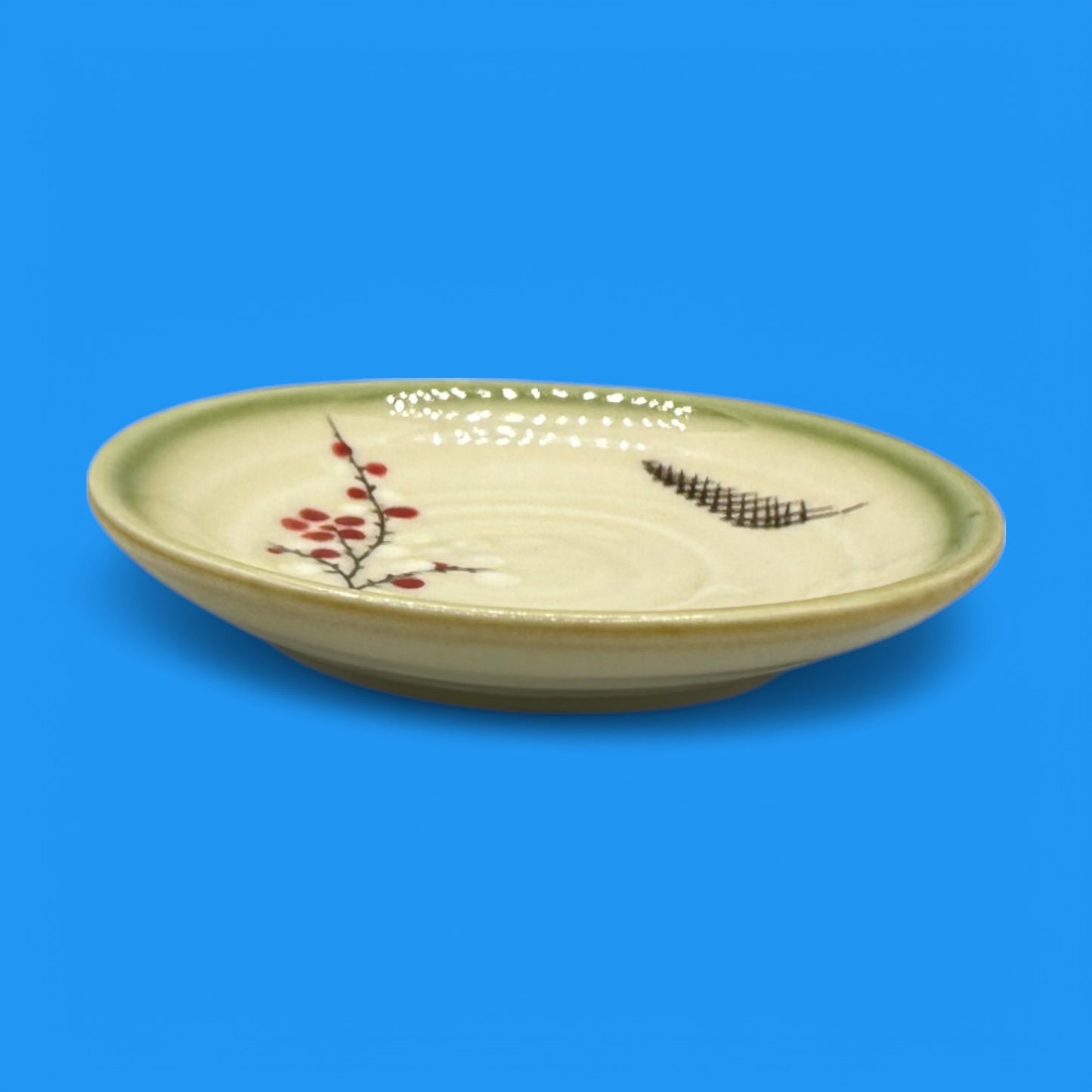 Vintage Japanese Celadon Dish - Plum Blossom Design showcases delicate green glaze with hand-painted plum blossoms.