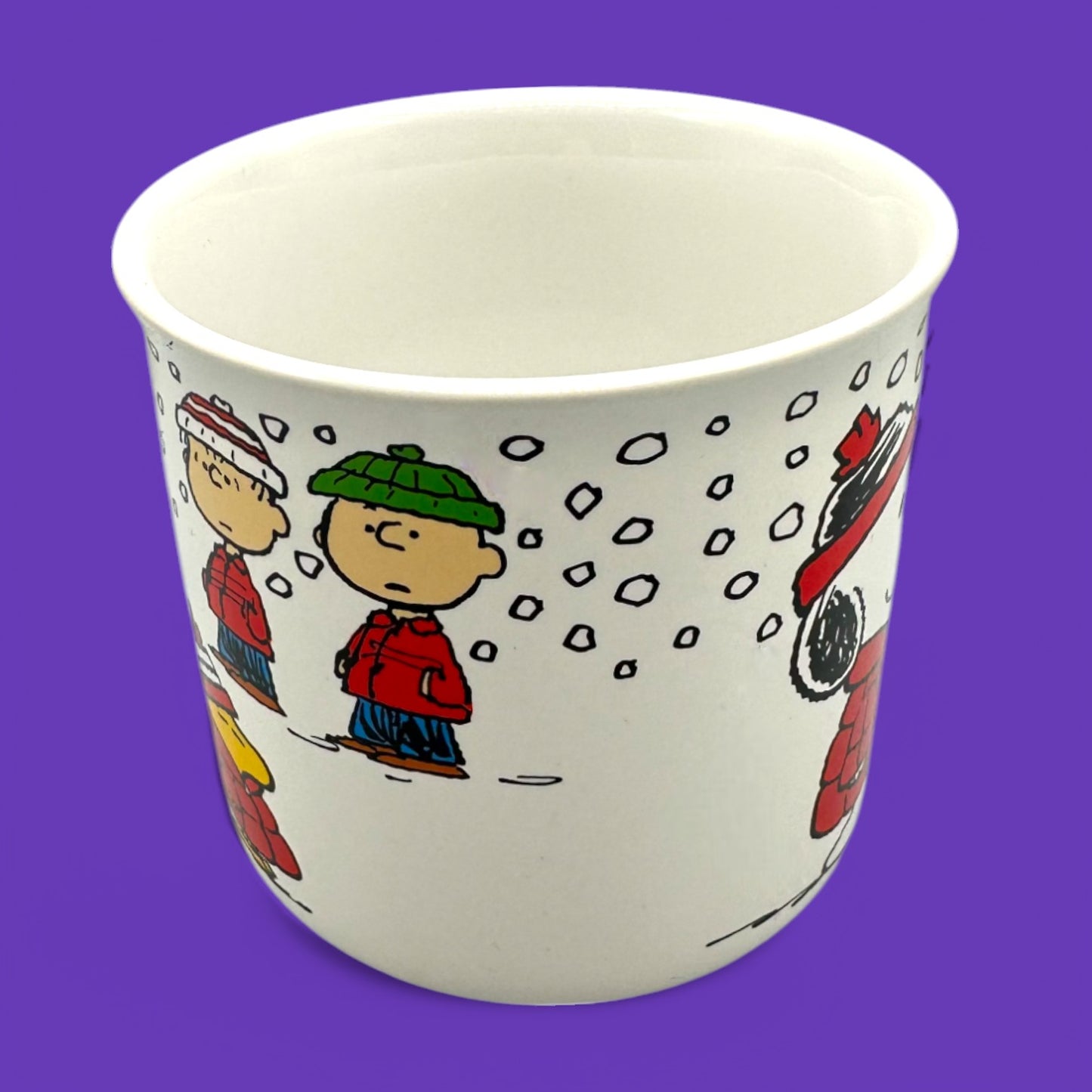 Vintage Peanuts Snoopy winter mug showcasing Snoopy and friends in cozy winter attire, perfect for collectors.