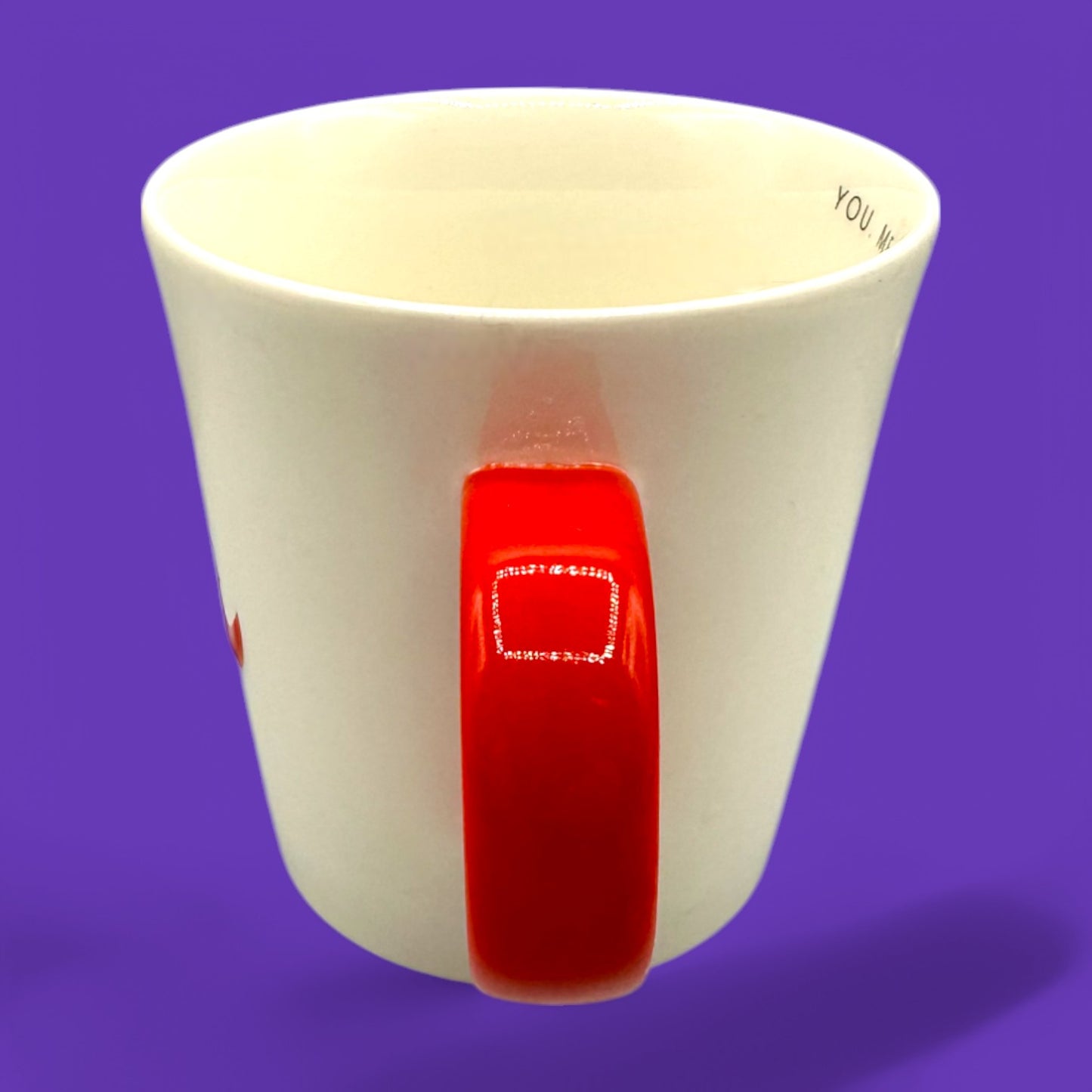 Starbucks You & Me mug features a white ceramic body with a vibrant red handle and ampersand, perfect for sharing.