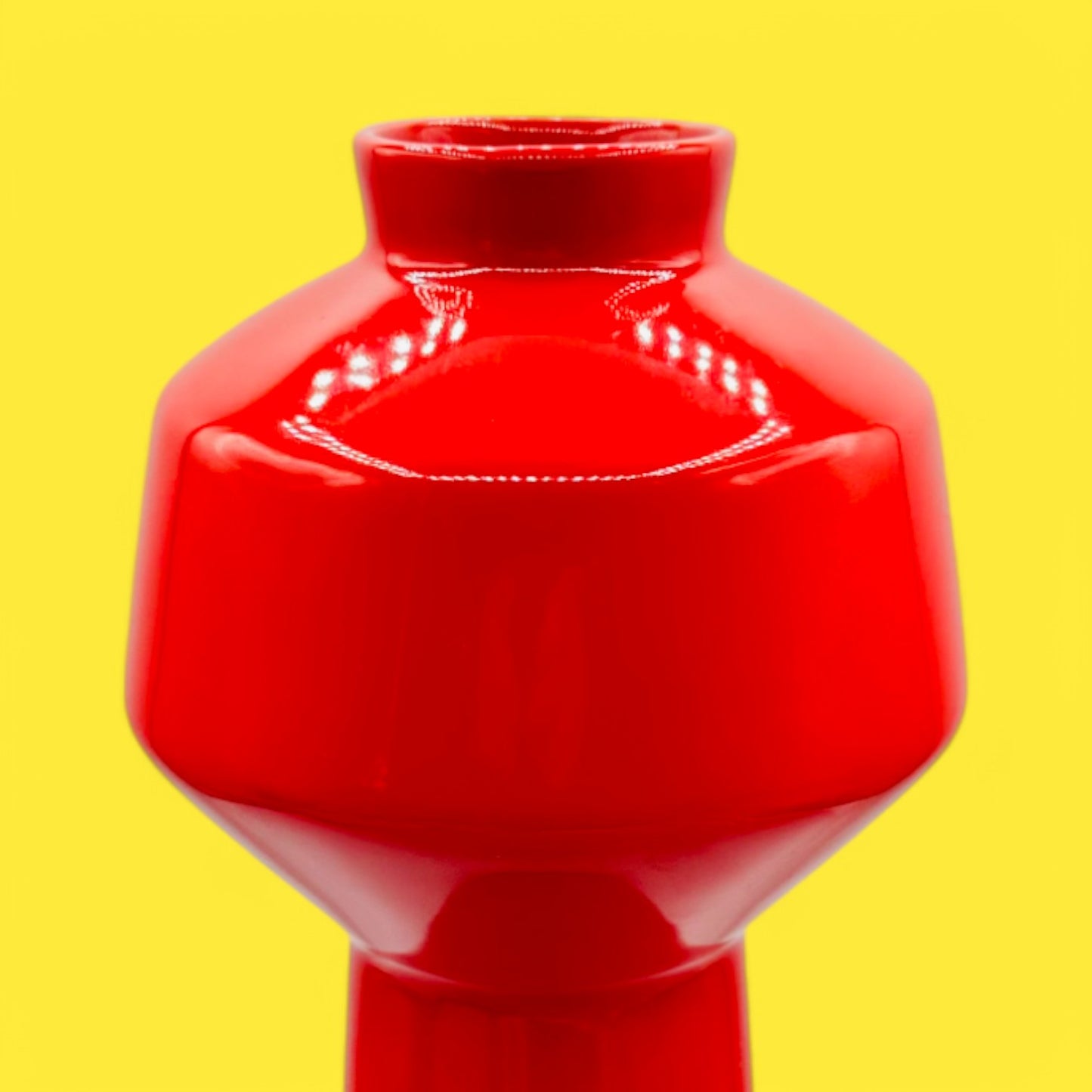 Brighten your space with the EQ3 Carnaby Red Vase, Mid-Century Modern Inspired Pop, showcasing a glossy, geometric design.