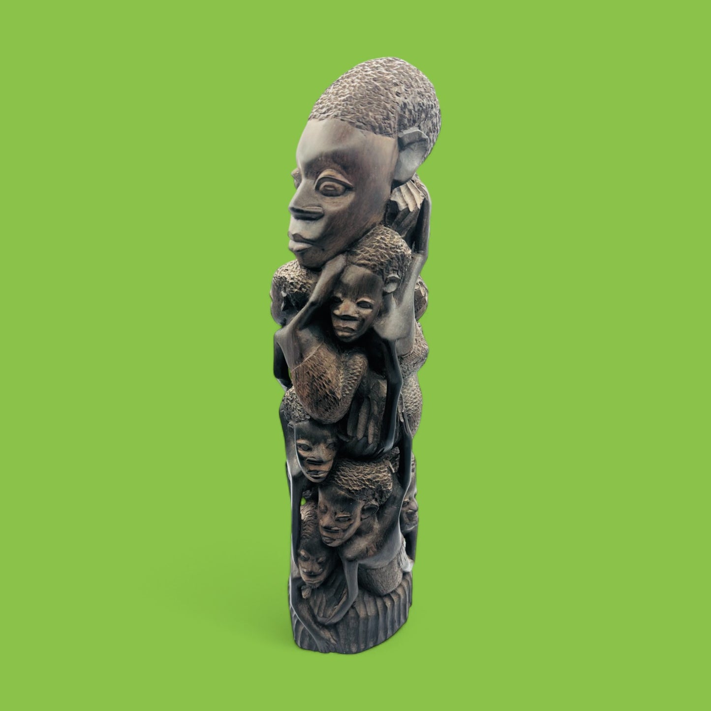 Explore the beauty of this Hand-Carved African Makonde Family Tree Sculpture / Carving Ebony Art, showcasing intricate details.