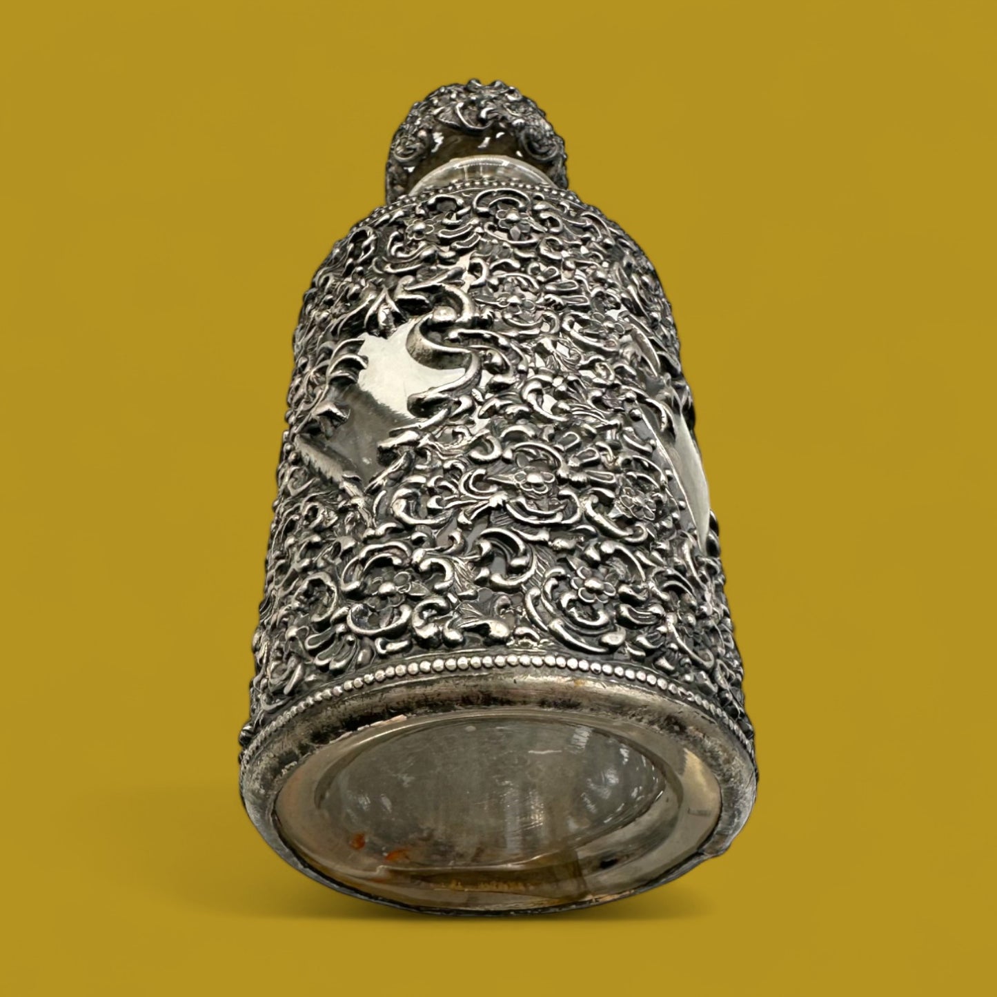 Antique ornate metal filigree perfume bottle with stopper