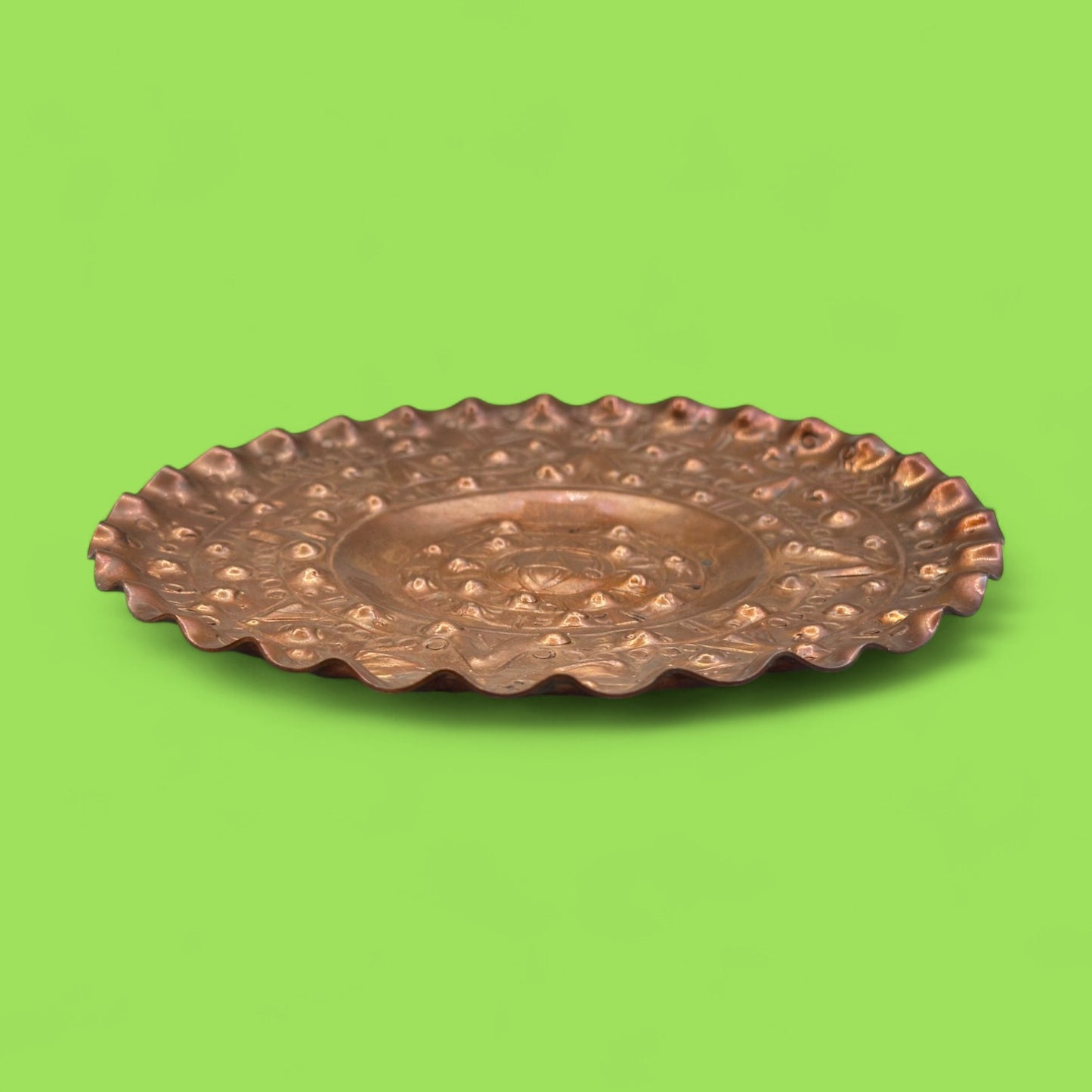 Vintage round copper plate with Aztec sun god design