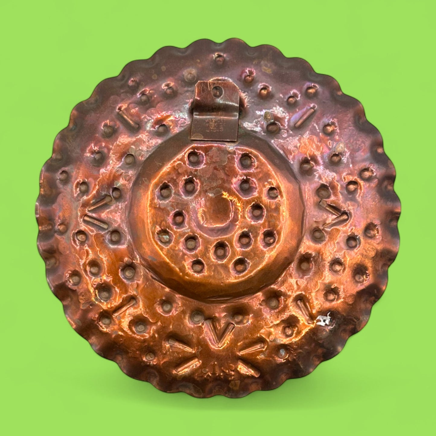 Vintage round copper plate with Aztec sun god design