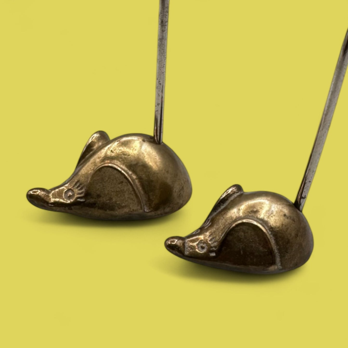 Pair of mid-century modern brass mice with curved tails