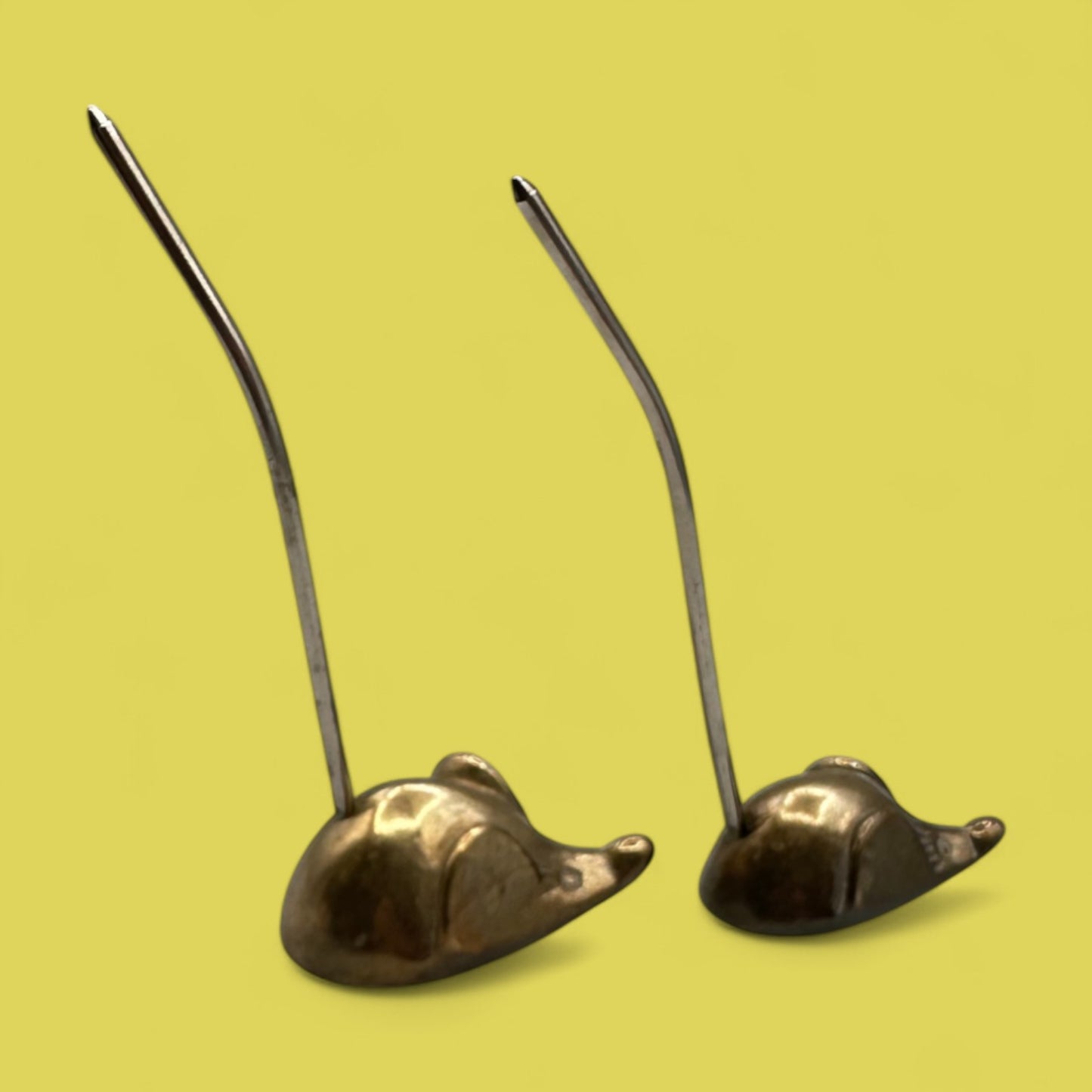 Pair of mid-century modern brass mice with curved tails