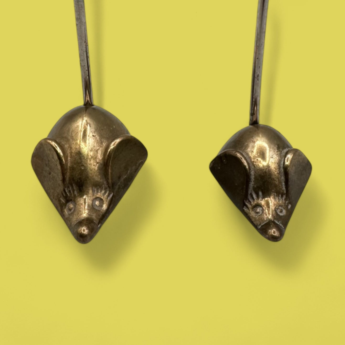 Pair of mid-century modern brass mice with curved tails