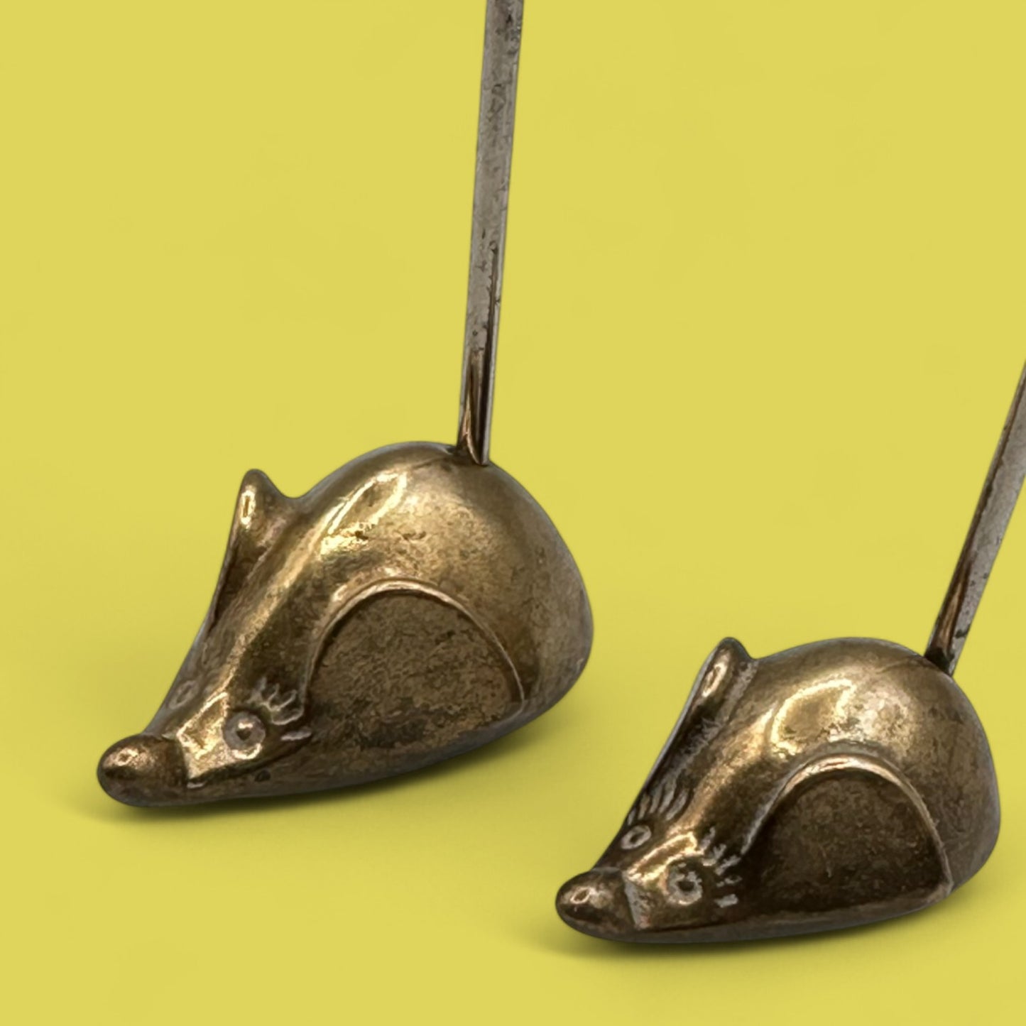 Pair of mid-century modern brass mice with curved tails
