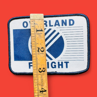Overland freight embroidered patch showcasing a vintage trucking design, perfect for truck enthusiasts.