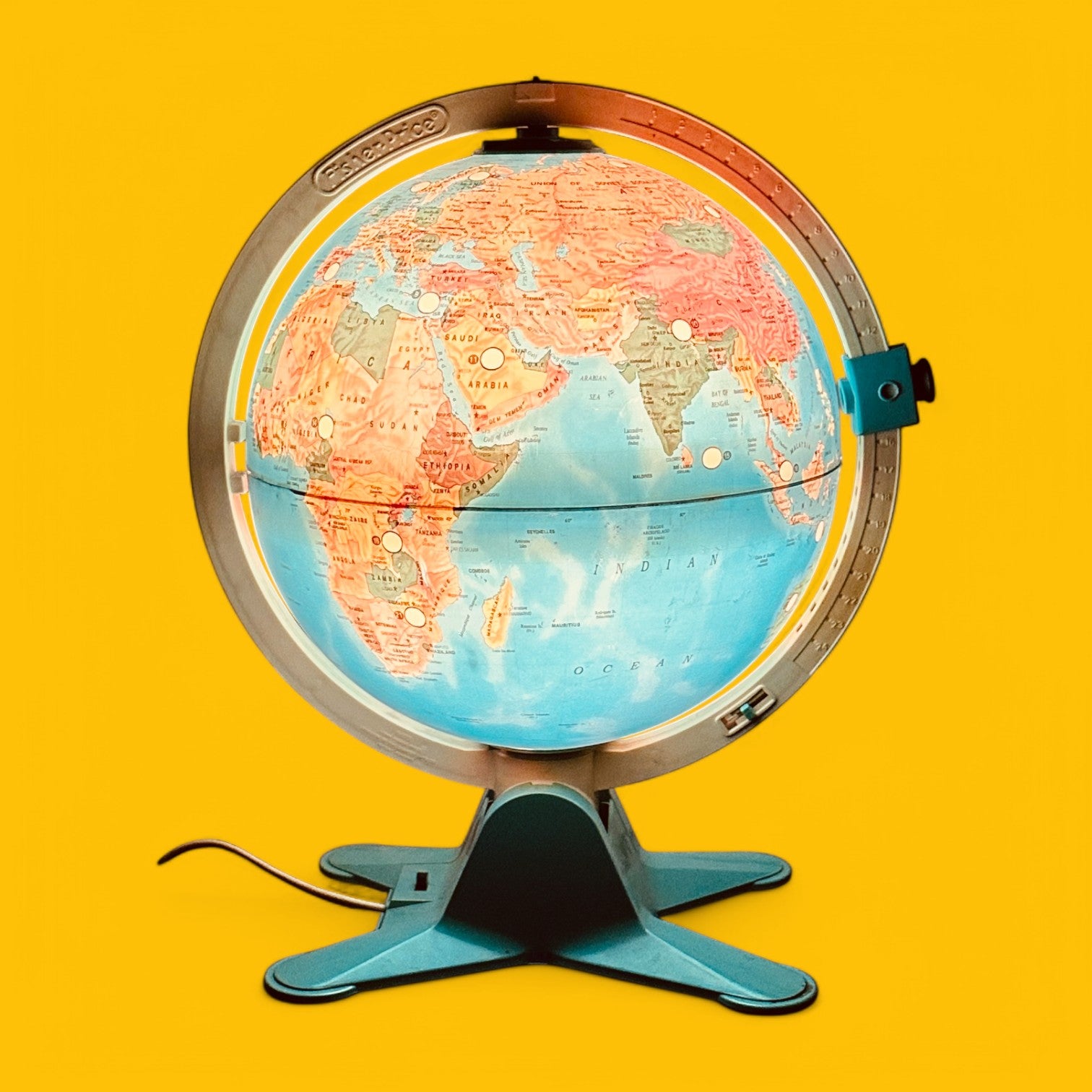 Fisher Price Illuminated Globe features vibrant colors and 24 interactive locations, perfect for educational play.