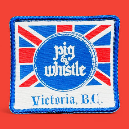 Vintage Pig & Whistle patch with Union Jack background and blue trim, from Victoria BC, measuring 3.5" x 3".
