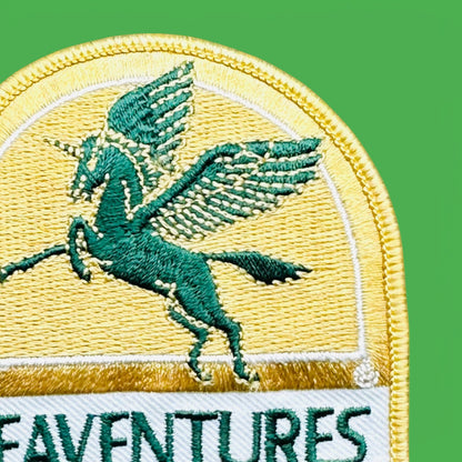 Seaventures Embriodered patch featuring a green Pegasus on a gold background, perfect for embellishing your gear.