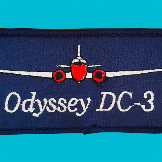 DC-3 Odyssey Embroidered Patch - Vintage NOS features a blue background with a red and white DC-3 silhouette.