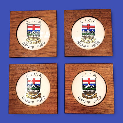 MCM 1960's Teak Drink Coaster Set | Convention: C.I.C.A Banff Alberta 1969 features elegant design and Alberta crest.