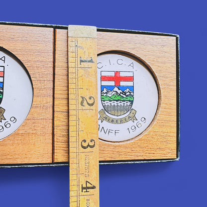 MCM 1960's Teak Drink Coaster Set | Convention: C.I.C.A Banff Alberta 1969 features Alberta crest and elegant design.