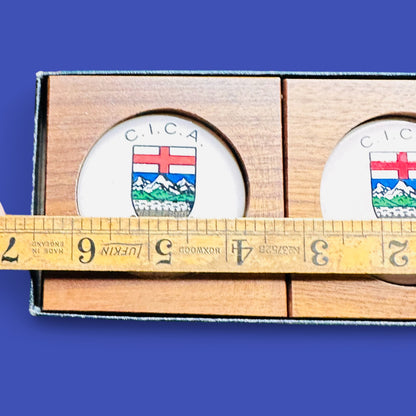 MCM 1960's Teak Drink Coaster Set | Convention: C.I.C.A Banff Alberta 1969 showcases Alberta Crest design in elegant wood.