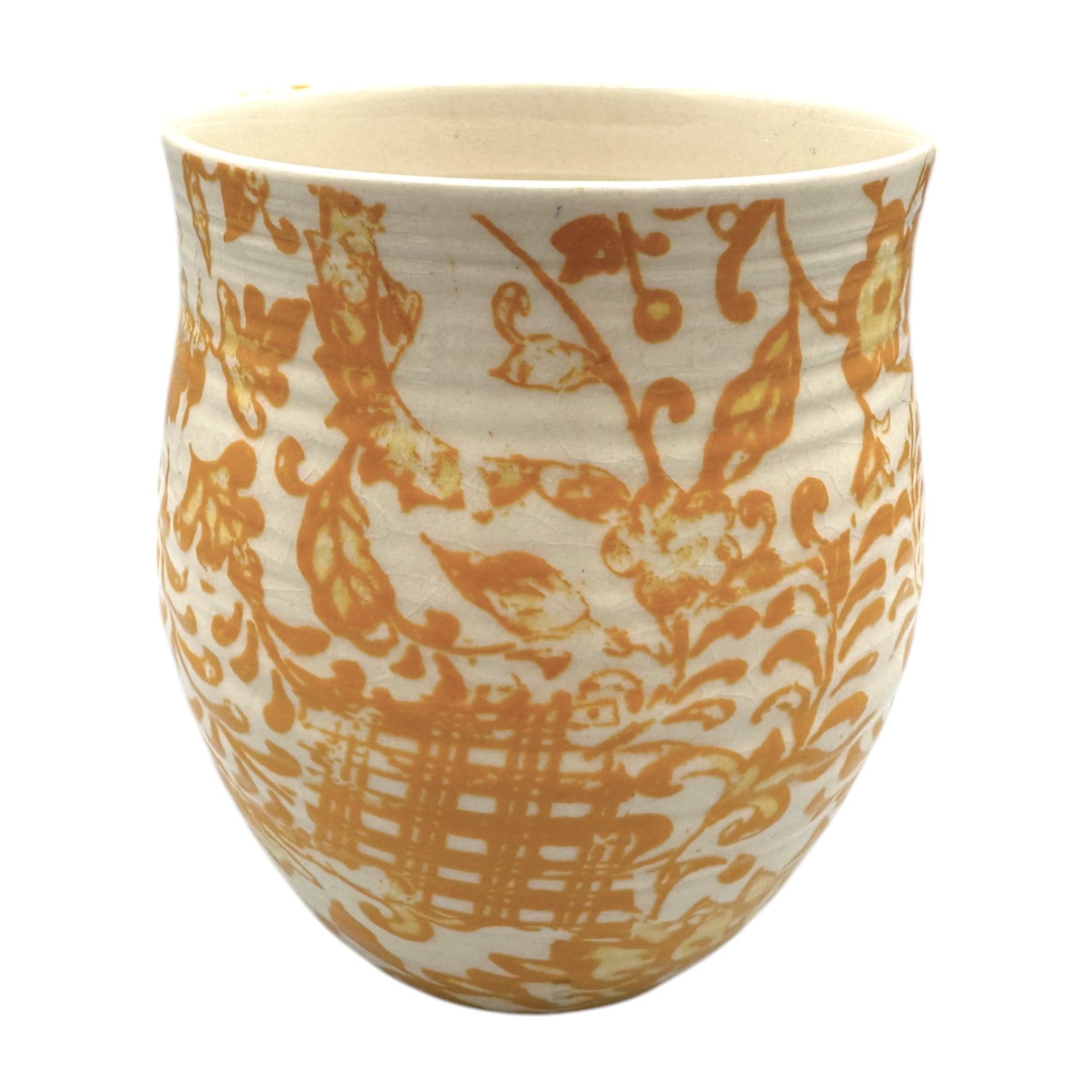Curved Anthropologie mug featuring monogram H in floral beige, yellow, and brown design with light crazing.