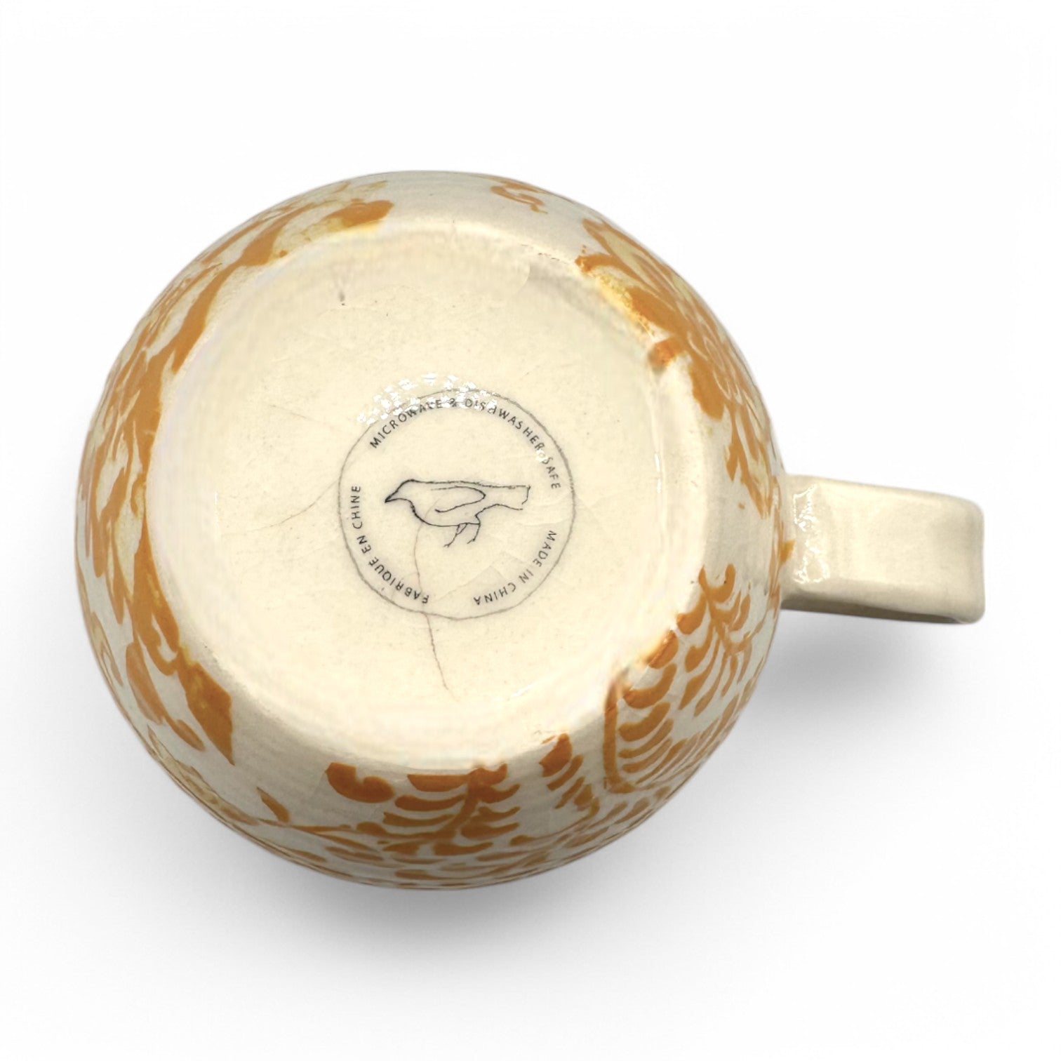 Anthropologie Mug with Initial H features a floral design in beige, yellow, and brown; curved Chinios style.