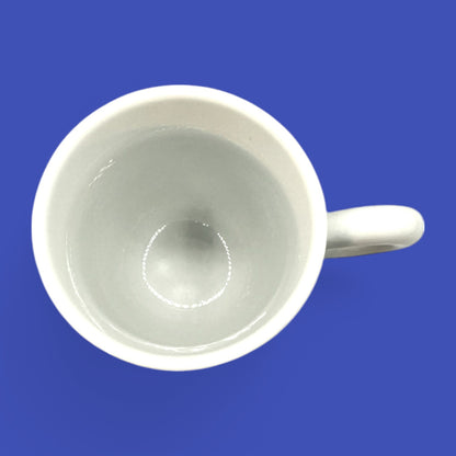 Sleek ILLY coffee mug in classic porcelain, featuring a round handle and the iconic red-on-white illy logo.