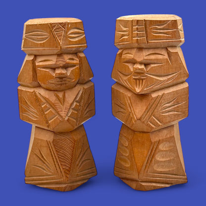 Hand-carved Japanese carved dolls showcase a unique Ainu couple in modern, abstract style made from cedar wood.