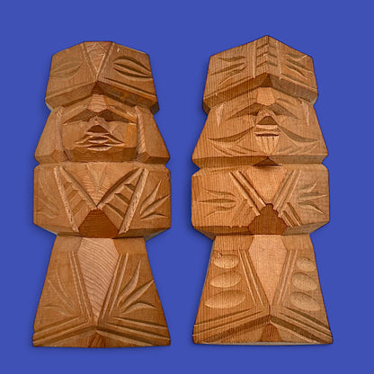 Vintage Japanese carved dolls showcasing a unique Ainu couple in abstract cedar wood design. Perfect for folk art lovers.