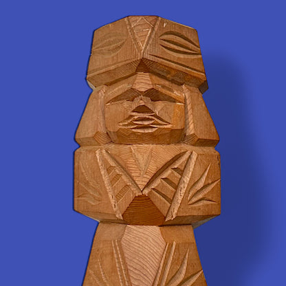 Hand-carved Japanese carved dolls showcasing a unique Ainu couple in modern brutalist style, perfect for folk art collectors.