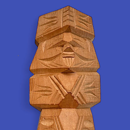 Hand-carved Japanese carved dolls showcasing a unique Ainu couple in modern brutalist style.
