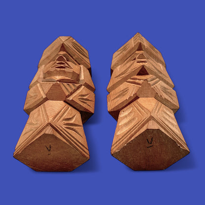 Unique Japanese carved dolls depicting a hand-carved Ainu couple in modern brutalist cedar wood style.