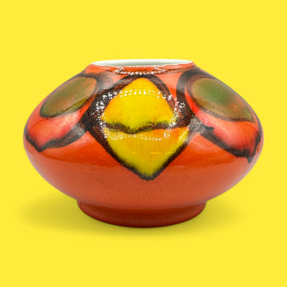 Colorful Poole pottery number 32 onion vase designed by Robert Jefferson, showcasing Delphis ware artistry.