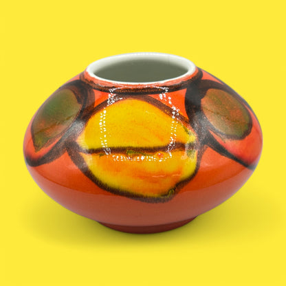 Brightly colored Poole pottery number 32 onion vase, designed by Robert Jefferson, showcasing vibrant Delphis ware style.