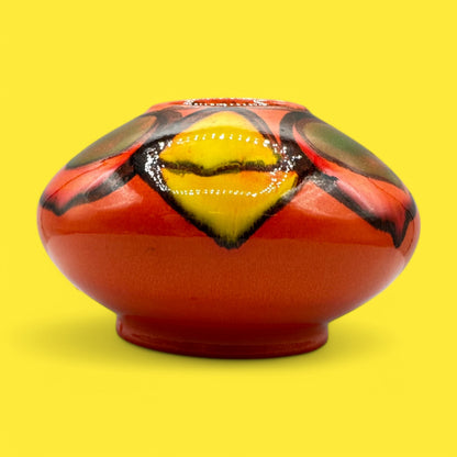 Colorful Poole pottery number 32 onion vase designed by Robert Jefferson, showcasing unique Delphis ware style.