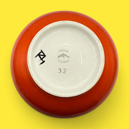 Poole pottery number 32 onion vase featuring the signature stamp and vibrant orange glaze, designed by Robert Jefferson.