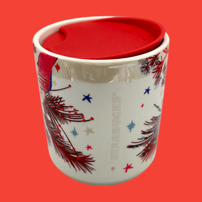Starbucks, red floral mug features a festive design with a red lid, perfect for holiday sipping on the go.