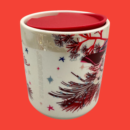 Starbucks, red floral mug features a festive design with a red lid, perfect for holiday beverages on the go.