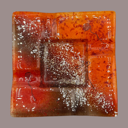 Vintage MCM Orange Fused Glass Sunburst Ashtray Decor showcases vibrant hues and textures, perfect for mid-century decor enthusiasts.