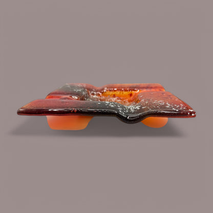 Vibrant Vintage MCM Orange Fused Glass Sunburst Ashtray Decor showcases stunning textures and a sunset-inspired hue.
