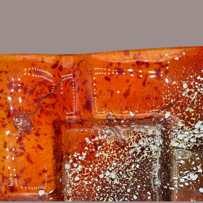 Stunning Vintage MCM Orange Fused Glass Sunburst Ashtray Decor showcases vibrant hues and dynamic textures for your collection.