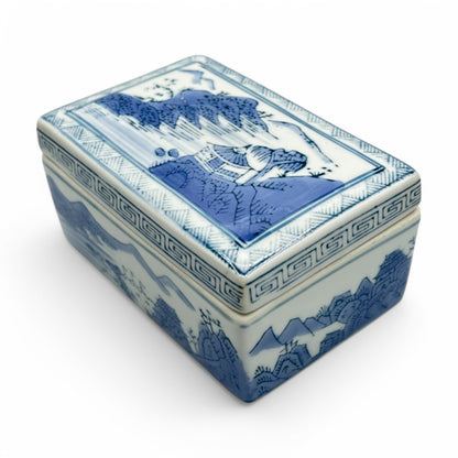 Elegant blue and white Chinese ceramic trinket box / ink box, featuring traditional landscape imagery, perfect for collectors.