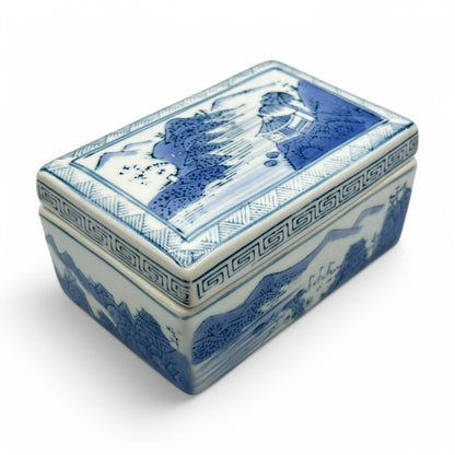 Elegant blue and white Chinese ceramic trinket box / ink box featuring traditional landscape imagery, perfect for decor.