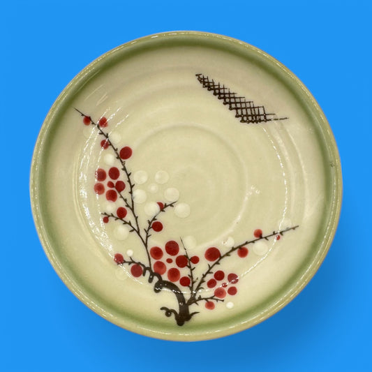 Vintage Japanese Celadon Dish - Plum Blossom Design featuring delicate green glaze and vibrant hand-painted blossoms.