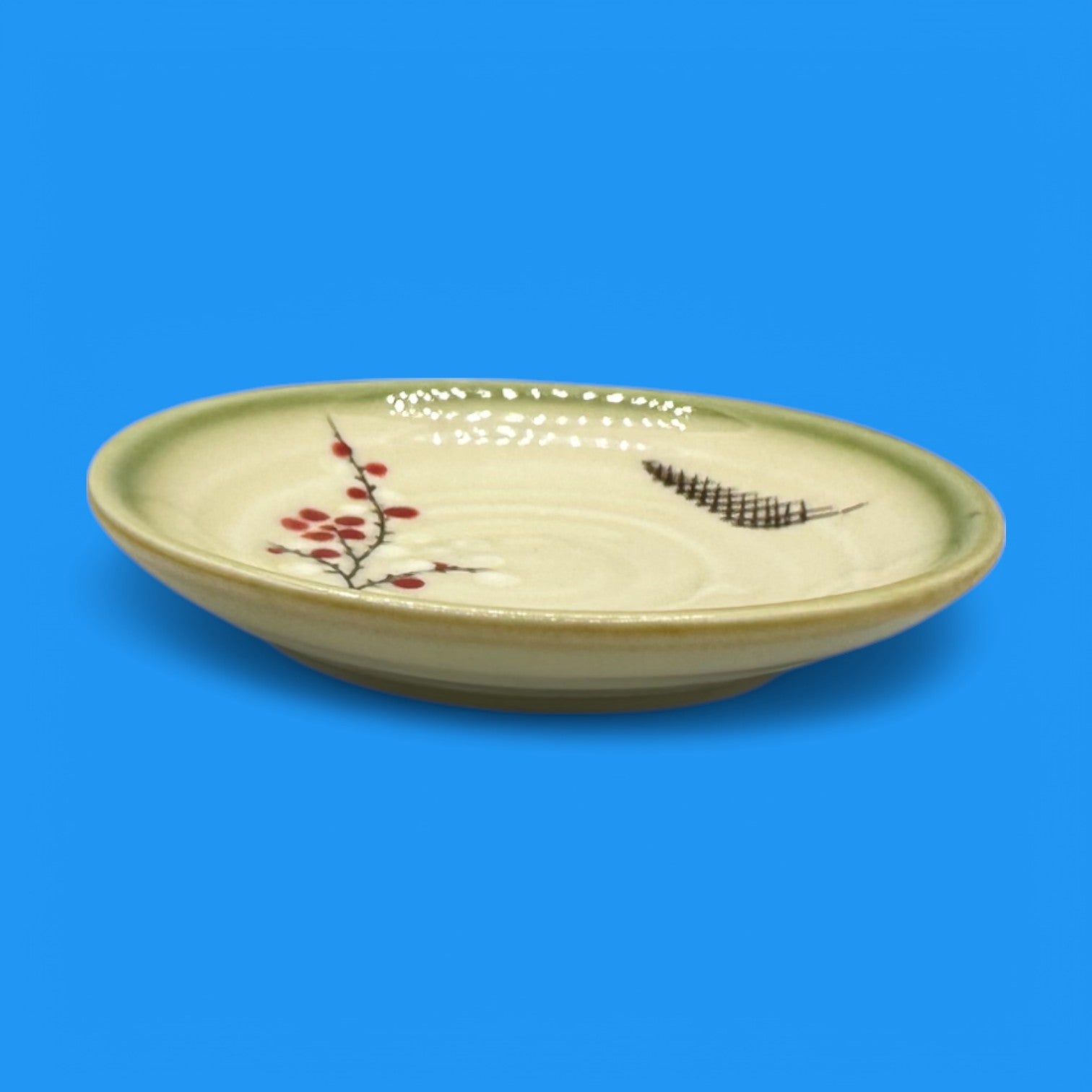 Vintage Japanese Celadon Dish - Plum Blossom Design showcases delicate green glaze with hand-painted plum blossoms.
